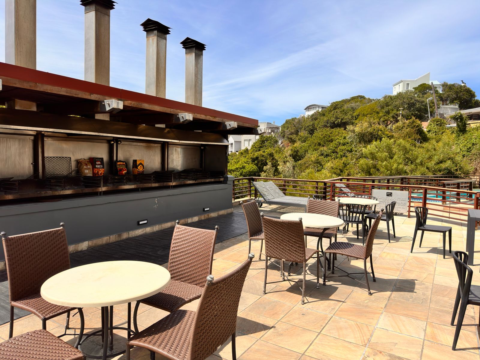 Communal braai and swimming pool area at The Herolds Bay Luxury Apartment building