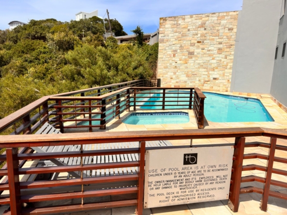 Communal braai and swimming pool area at The Herolds Bay Luxury Apartment building