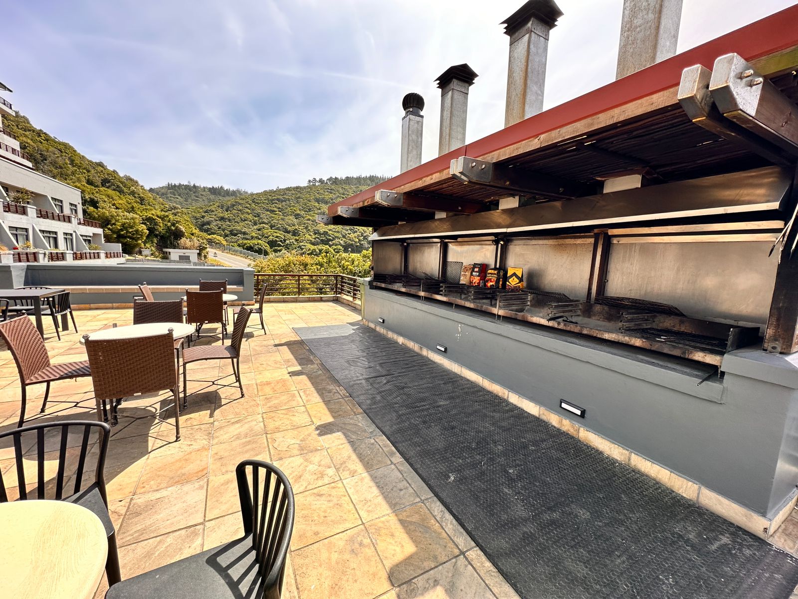 Communal braai and swimming pool area at The Herolds Bay Luxury Apartment building